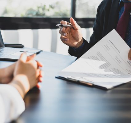 Businessman showing customer insurance policy