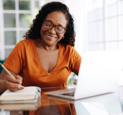 Happy woman writing her will
